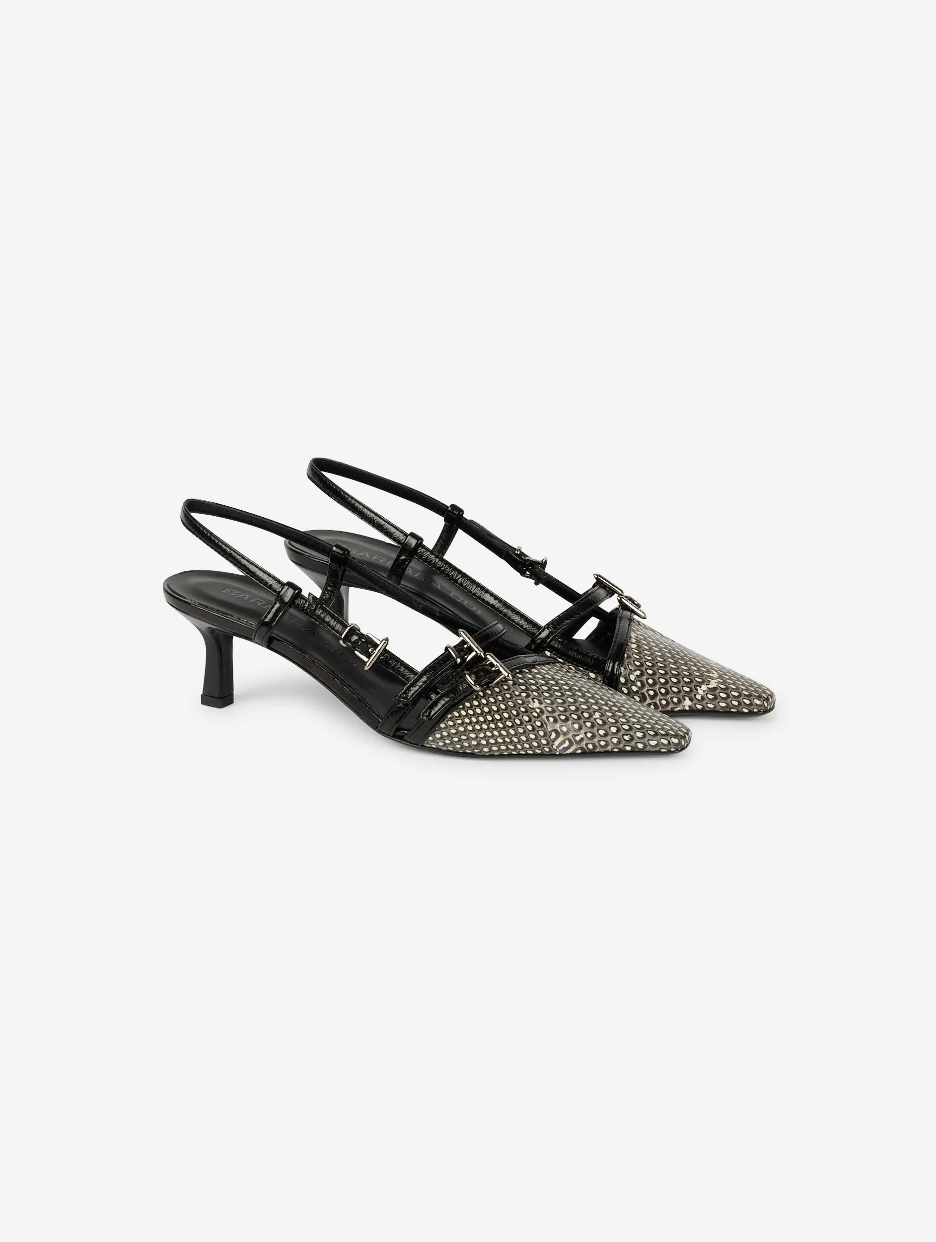 Black patent and ivory and black reptile slingback pumps